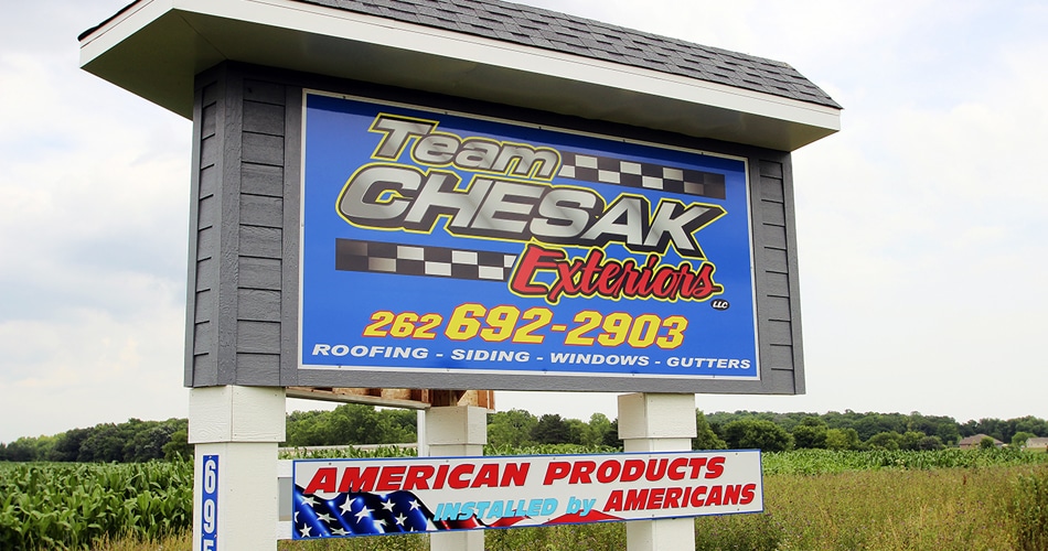 Ground mount monument reflective sign for Team Chesak Exteriors Newburg, Wisconsin.