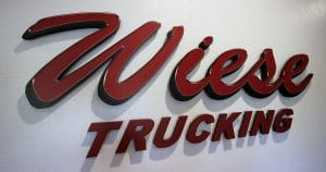 Wall sign dimensional routed logo for Wiese Trucking Inc. Lomira, Wisconsin.