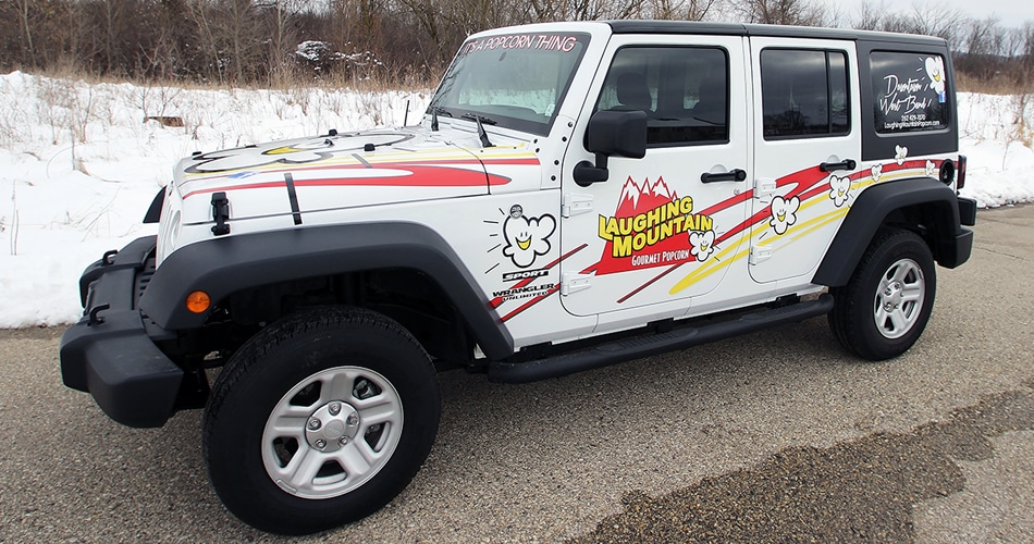 Jeep Wrangler lettering & graphics for Laughing Mountain Gourmet Popcorn West Bend, Wisconsin.