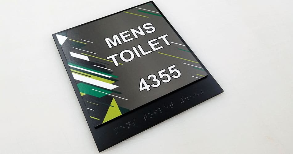 Men's toilet ADA wall signs, braille.