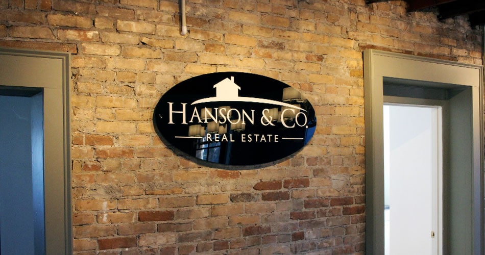 Business signs interior wall office sign for Hanson & Co. West Bend WI.