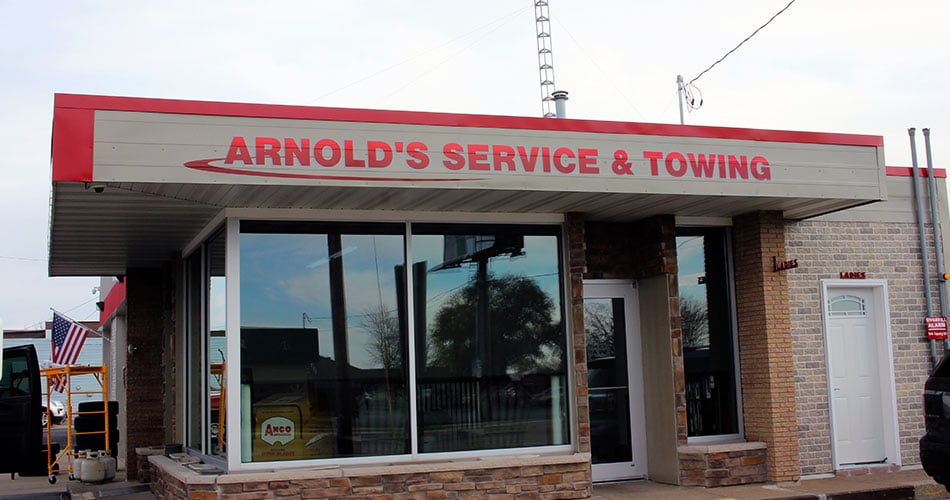 Exterior building signs for Arnolds Towing in Sparta, WI.