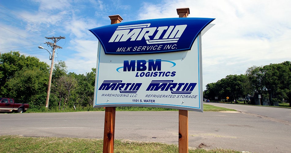 Outdoor business signs for Martin Milk in Sparta, WI.