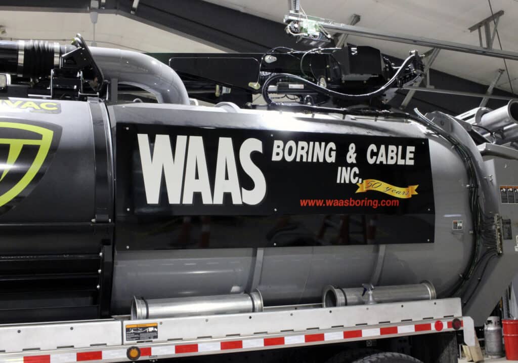 WAAS truck tank vinyl lettering.